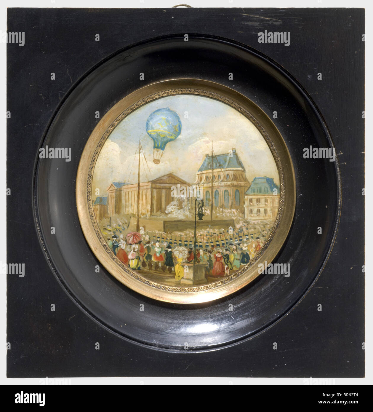 The first manned ballooning on 21. November 1783 - a miniature painting, oil on copper, France, 1st half of the 19th century. Unsigned. Detailed painted scene. The balloon of the physicist Jean-Fran‡ois Pilâtre de Rozier and of the guard-officer Fran‡ois d'Arlandes over the impressive Château de la Muette. In the courtyard of the castle wads of smoke can be seen from the fire necessary for the production of heated air. In the foreground spectators and a honour guard of soldiers. Diameter circa 7.5 cm. Mounted in brass and an ebonised wooden frame. The verso cov, Stock Photo
