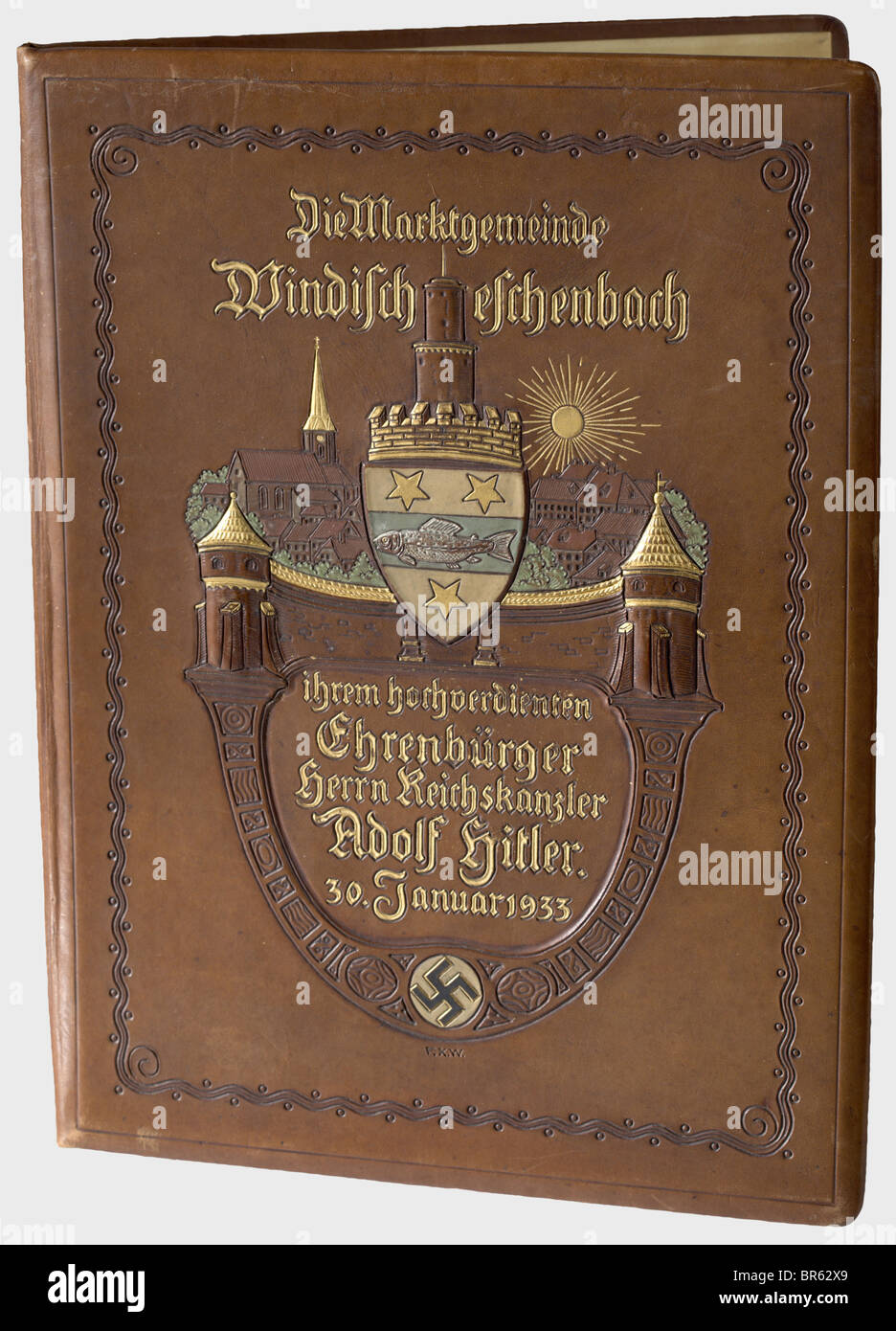 Adolf Hitler - a certificate of honorary citizenship, and naming of the main square in 'Adolf Hitler Platz' to honour the Reich Chancellor Adolf Hitler, by the municipality of Windischeschenbach (Bavarian Ostmark), dated 23 May 1933. Designed in fine hand-painting with a depiction of the village, Bavarian coat of arms and swastika. Calligraphic text. In a gold-stamped leather folder with city coat of arms. Dimensions 40 x 30 cm. Today the town is known especially for the Eschenbach porcelain and the continental deep drilling to a depth of nearly 10.000 m. histo, Stock Photo