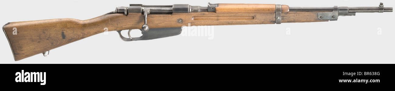 A Carcano model 38 short rifle - spoils of war, modified to 8 x 57 cal. by Krieghoff, No. H6378. Almost bright bore. Encircled Krieghoff logo 'HK' on receiver, on barrel root marked '7,9', on the right German military proof mark eagle/'HK'. As with K 98 k stock peg-reinforced on receiver head level to prevent stock splintering due to recoil of powerful 8 x 57 cartridge. Originally produced by Terni Arsenal in 1941. Fixed sight for 200 m, still marked 'cal. 6,5'. Complete finish with light wear marks, also on stock. Very good condition of a rare, originally modi, Stock Photo