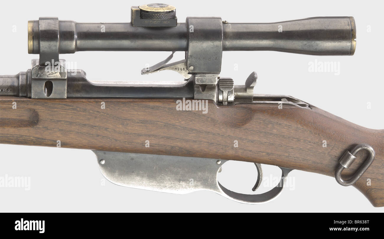 A model 1895 repeating carbine with scope, 8 x 50R cal., no. 6059M. Matt bore. Manufacturer's inscription covered by scope mount. Military proof mark Vienna 1915. Spotted finish. Lock in the white. Almost faultless rough elm wood stock no. 6610Q with original strap and screwed in pyramid pin. Good to very good overall condition. Mounted scope 'C. REICHERT WIEN No. 4842', 3-fold enlargement, brass top ring for range setting scaled 1 - 7, reticule similar to no. 8. Scope technically and optically in good order. Finish lightly rubbed off. Frog mount with locking l, Stock Photo