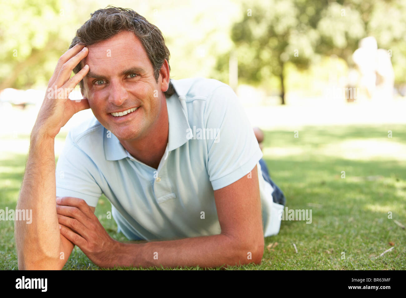 Portrait Of Young Man In Park Stock Photo - Alamy