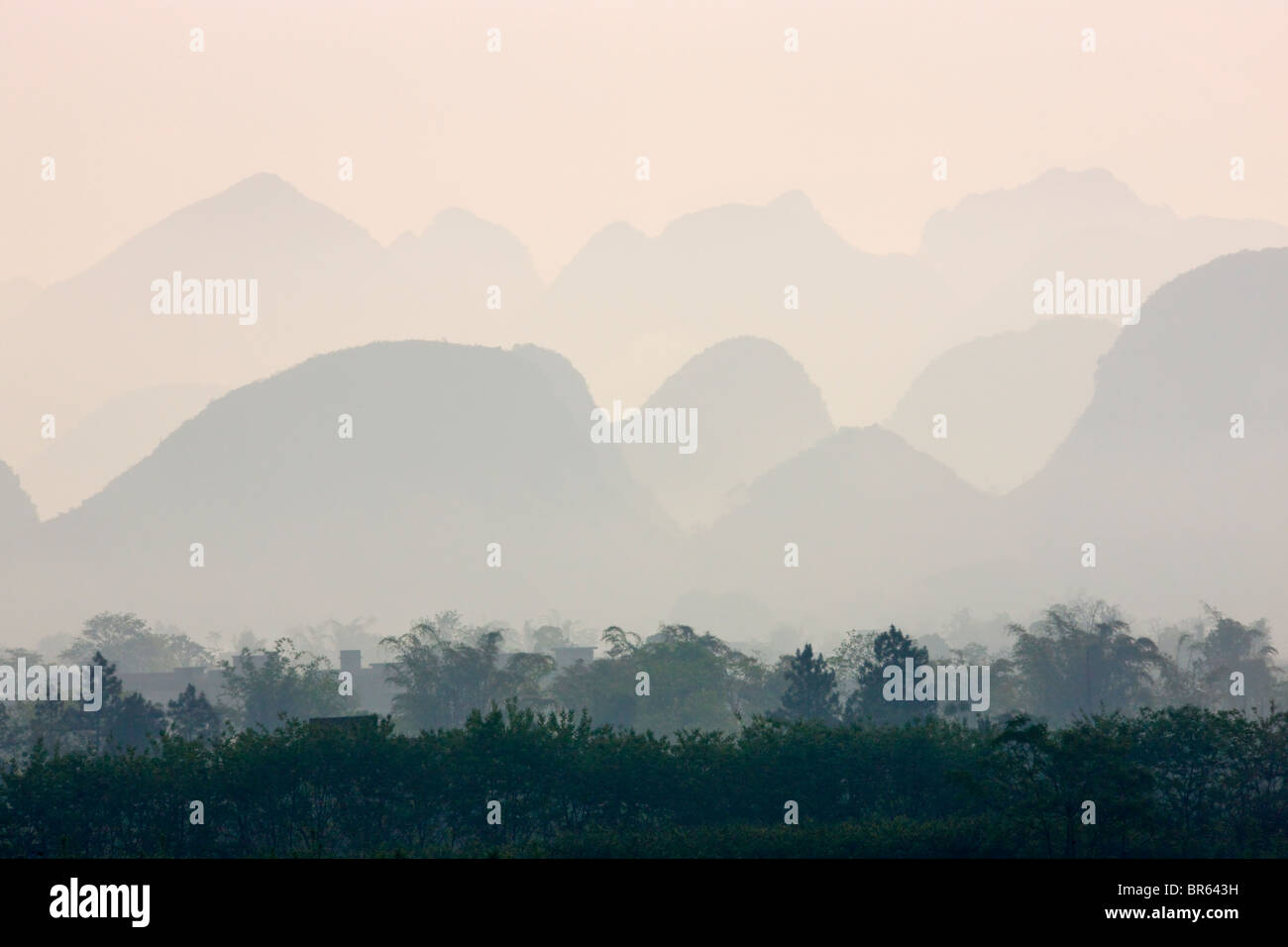 Karst hills in morning mist, Yangshuo, Guangxi, China Stock Photo