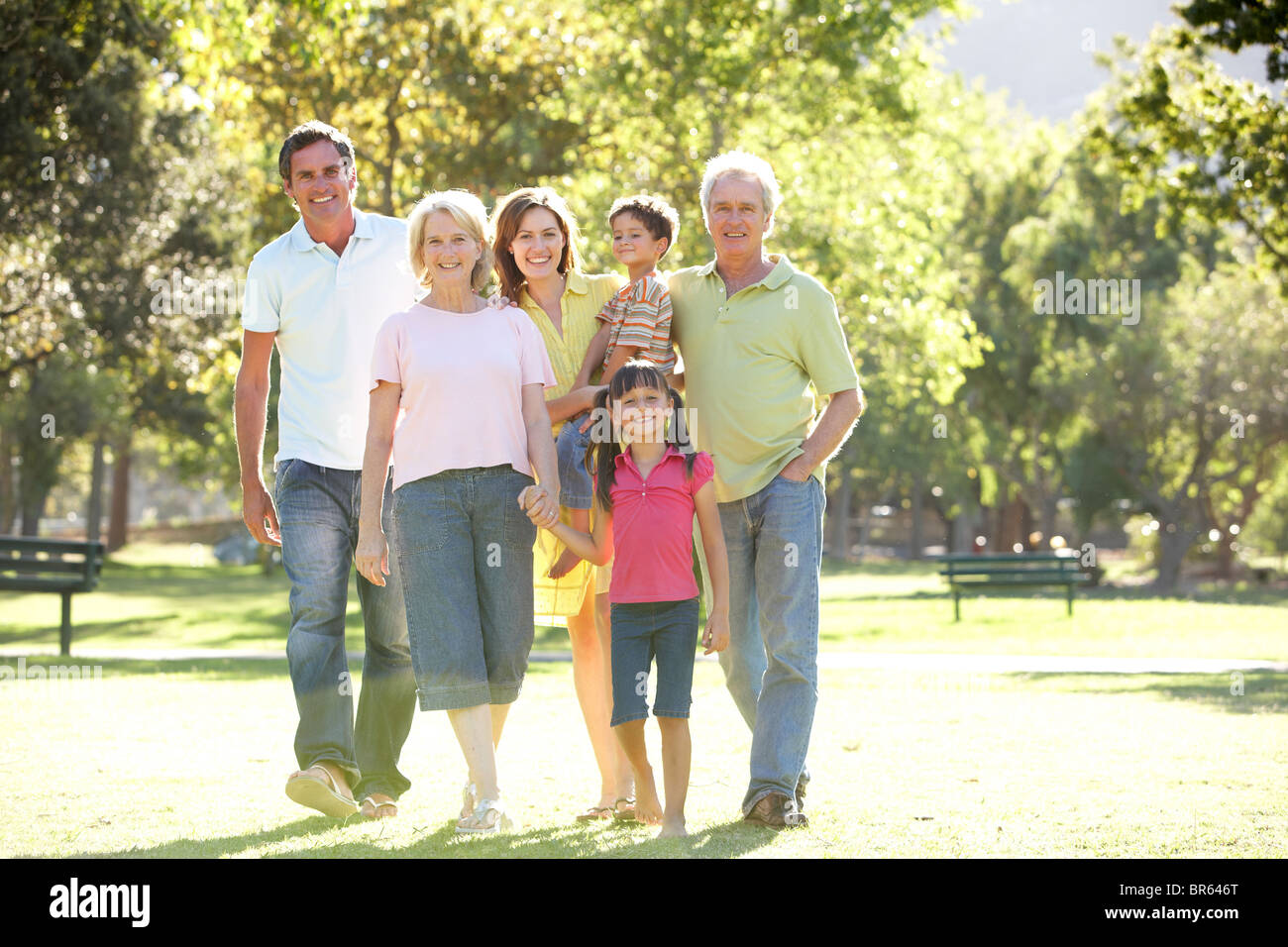 Extended Group Portrait Of Family Enjoying Walk In Park Stock Photo
