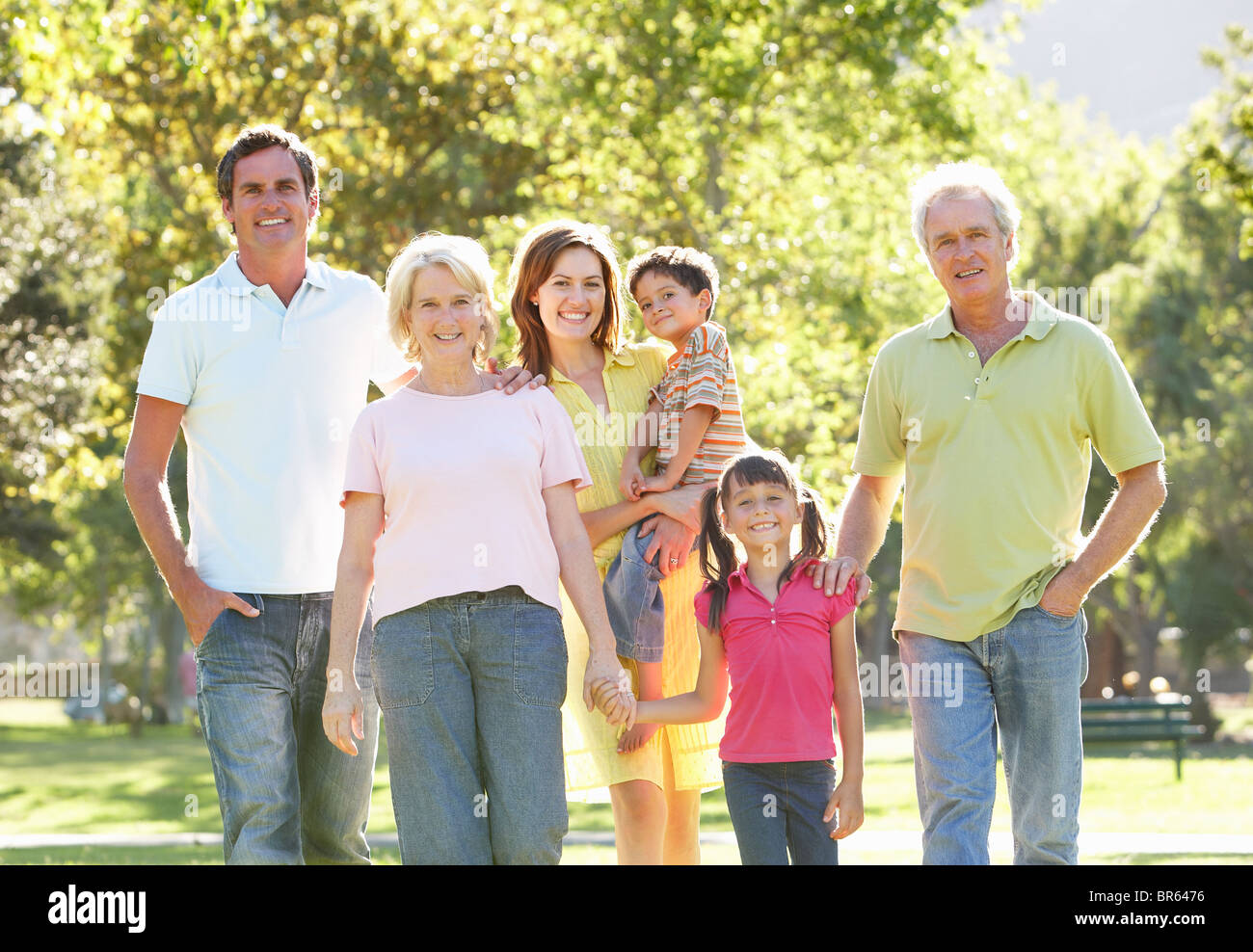 Extended Group Portrait Of Family Enjoying Walk In Park Stock Photo