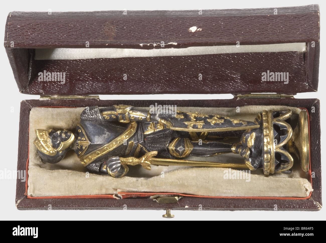 King Ludwig II of Bavaria (1845 - 1886) - a personal seal., Silvered and gilt bronze. The handle in the shape of a historical, knight in full armour, the right hand resting on his golden sword, in the left the shield with fleurs-de-lis. On a neogothic socle. The seal matrix with reverse monogram 'L' based on the monogram of the French Sun King Louis XIV, surmounted by the Bavarian Royal crown. Height 10,8 cm. In a velvet and silk lined case with label and handwritten inventory number '306.' on the lid, the bottom with remains of another label. Cf. a similar sea, Stock Photo