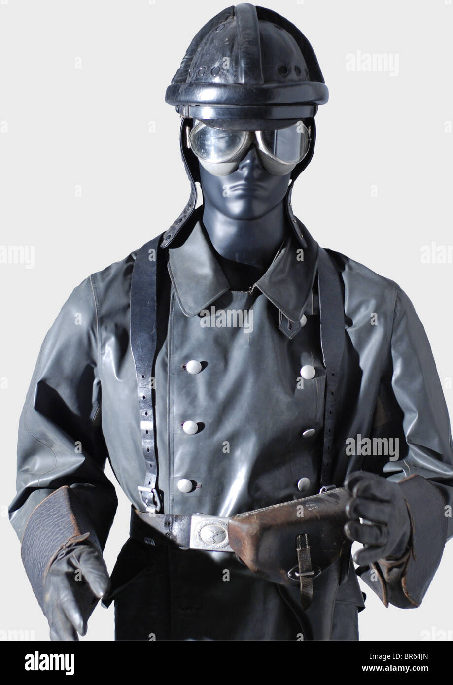 A Luftwaffe motorcycle suit., A black leather crash helmet with protective cylindrical padding, a one-piece neck protector with earflaps and chinstraps with snaps, straps above the visor, inset screened ventilation holes. Folded black cotton lining, stamped under the leather sweatband with 'G. Pose Leder GmbH Hn(?) 0 34' (G. Pose Leather GmbH Hn 0(?) 34) and the acceptance mark 'L.B.A.B. 37'. Size 59. A very rare helmet, as only a few were issued during a period of a few weeks. The rest were used later with military gliders. Also a greyish rubberised linen prot, Stock Photo