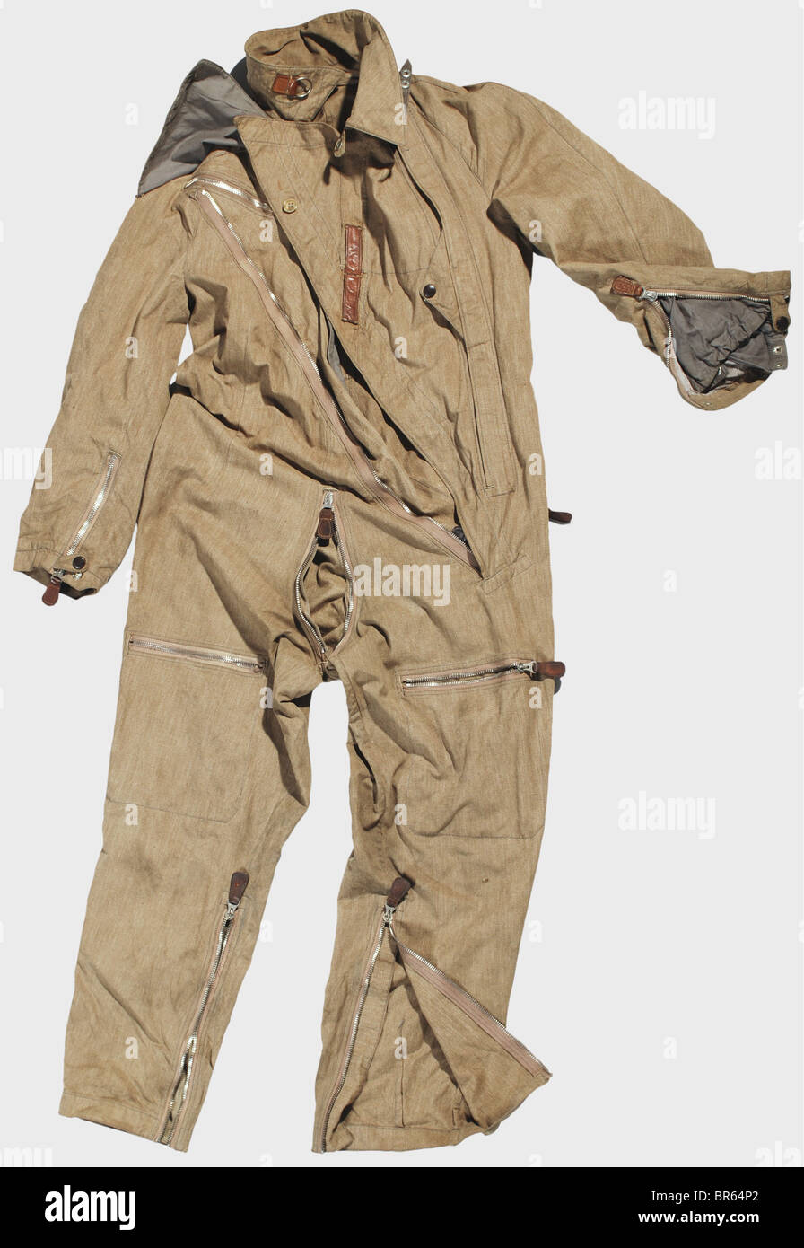 A special summer flying suit for a Luftwaffe bomber crew., An early model LKp W100 flying helmet of sand-coloured linen with brown leather trim, plastic earphone shells, three point attachment for an oxygen mask, separate communications system with twin throat microphones in series, and two connector cables with quick release connectors. Stamped '10. Staffel' (10th Squadron). Protective goggles with adjustable bridge and permanent 'soft' lenses (damaged). A sand-coloured linen flying suit with diagonal zippers, Prym snaps, and Rheinnadel zippers (one defective), Stock Photo