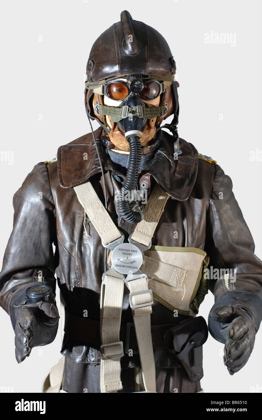 A Luftwaffe fighter pilot in the Reich's air defense., A model SSK 90 pilot's steel helmet. Skull of riveted steel plates with brown leather cover and cylindrical head pad, sand-coloured mottled cotton lining, complete with straps. A LKp S101 sand-coloured, linen flying helmet with brown leather trim, three- historic, historical, people, 1910s, 20th century, Second World War / WWII, object, objects, clipping, cut out, cut-out, cut-outs, stills, military, militaria, Luftwaffe, German Air Force, branch of service, branches of service, armed service, armed service, Stock Photo