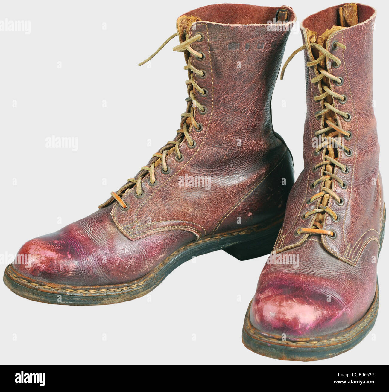 A pair of paratrooper boots, reddish leather with twelve pairs of lace eyelets on the front and a buckskin tongue, Leather laces. The legs are stamped '31 or '32 5 44 88' respectively. Leather soles stamped '32 5', made to accept ski bindings and with iron plates. Clearly worn with signs of age. Very rare. historic, historical, 1910s, 20th century, Second World War / WWII, object, objects, clipping, cut out, cut-out, cut-outs, stills, military, militaria, Luftwaffe, German Air Force, branch of service, branches of service, armed service, armed services, utensil, Stock Photo