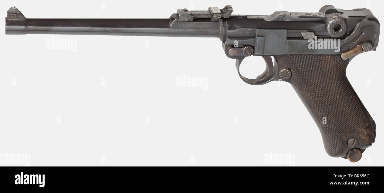 A Long Pistol 08 Erfurt 1914, cal. 9 mm Parabellum, no. 3882. Matching numbers including firing pin, except breech catch, trigger plate numberless. Slightly matt bore. Acceptance marks crown/Gothic letter on all parts. Tangent rear sight scaled 1 - 8, front and rear sight adjustable. Reblued. Small parts strawed. Walnut grip panels with matching numbers. Nickel-plated sheet metal magazine with numberless wooden base. Complete with non-original, but professionally made, suitable shoulder stock. Collar blued. One of the rarest Long Pistols 08 available, only manu, Stock Photo