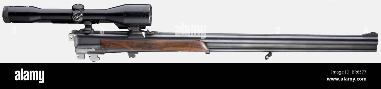 A heavy deluxe over-and-under rifle with two interchangeable barrels and two scopes, Sodia Ferlach, cal..458 Win.Mag., barrel length 60 cm, first barrel 7 mm cal. Rem.Mag./12/76, length 66 cm, second barrel ventilated 12/76 cal., length 72 cm, both no. 22781. Bright bores. Austrian proof mark 12/79, German proof mark 1998. Both extension ribs with signature 'FRANZ SODIA, FERLACH'. Greener bolt with double lugs. Ejectors. Double trigger, the front one a set trigger. Complete original finish of all barrels. Light system with lavish and fine elephant, buffalo, rhi, Stock Photo