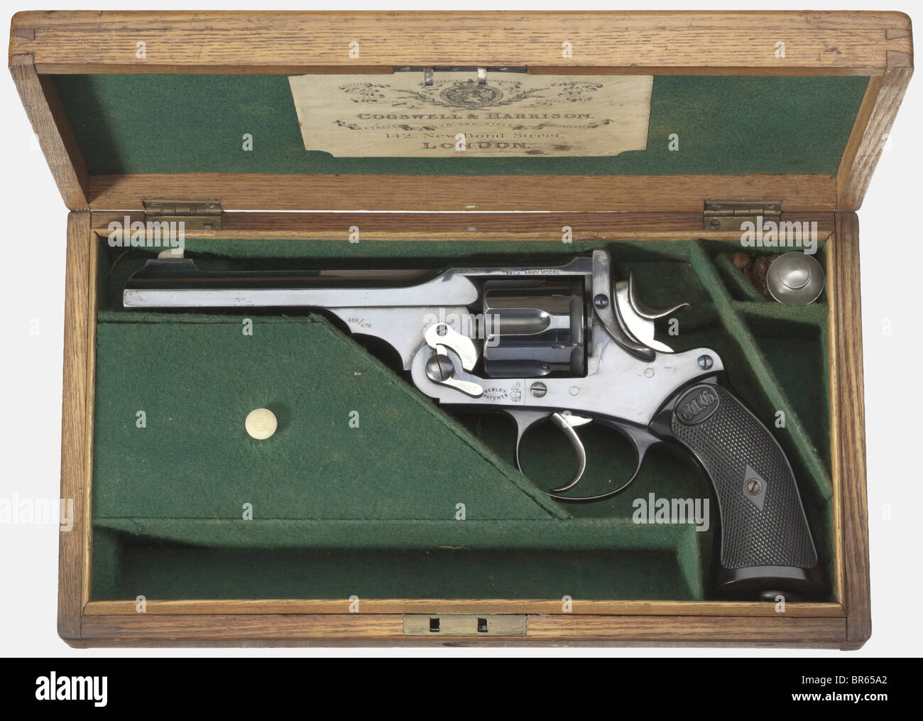 A cased Webley W.G. Army, circa 1899. In cal..455/.476, no. 14860. Matching numbers. Mirror bright bore. Ridged barrel. Barrel length 6 inches. Nickel-silver front sight. 6-shot. Merchant's address "Westley Richards & Co. Ld. London W." on the frame bridge, "WG Army" on the left side of the frame, "455/476" on the barrel housing, and "476" on the cylinder. Complete, original, blue/black, high gloss bluing. Special model with polished hammer, trigger, and cylinder latch, and immaculate black hard rubber grips with the Gothic "WG" logo. Lanyard ring. Absolutely s, Stock Photo
