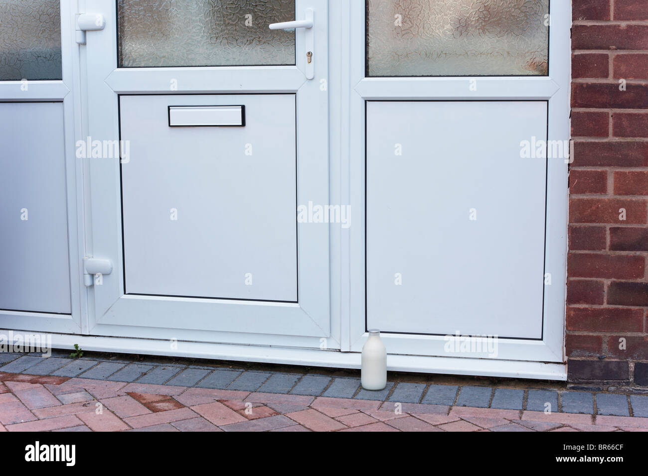 Pint of milk on the doorstep, UK Stock Photo