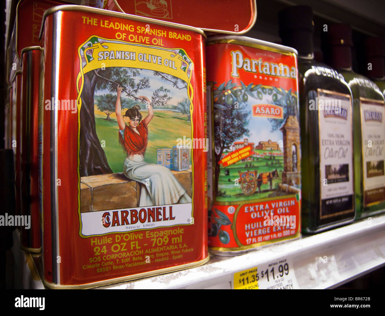 Cans of imported olive oil including Spanish are seen on a supermarket ...