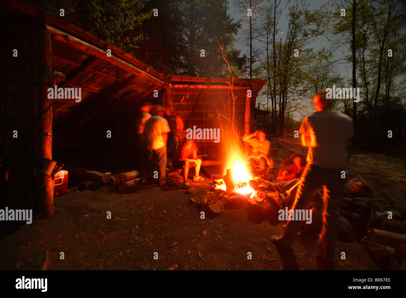 Climbers gather around the fire in the evening at the Stock Photo