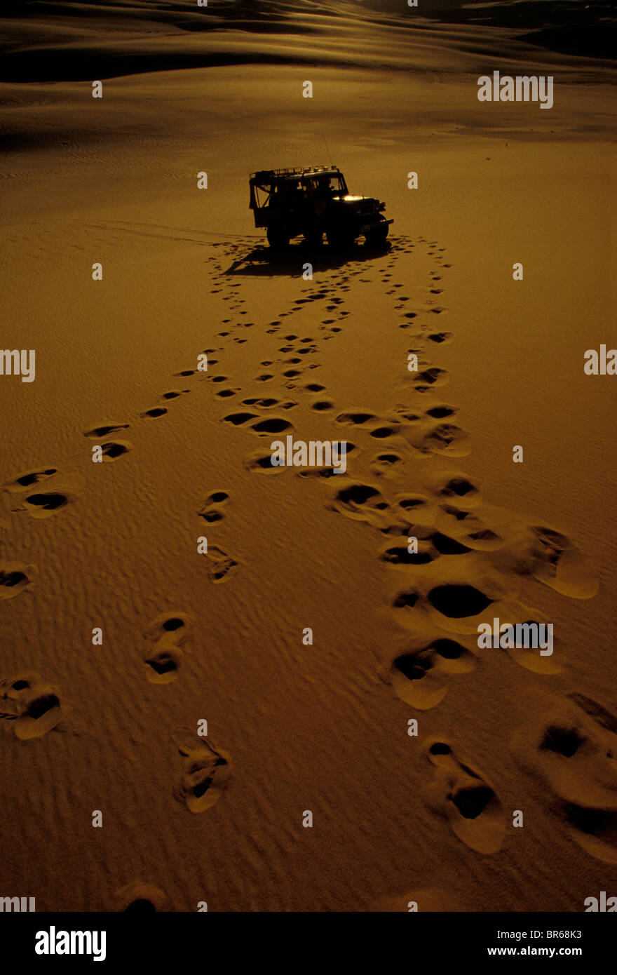 Land cruiser and footprints on a dunes near Siwa Oasis Egyptian Western Desert Stock Photo