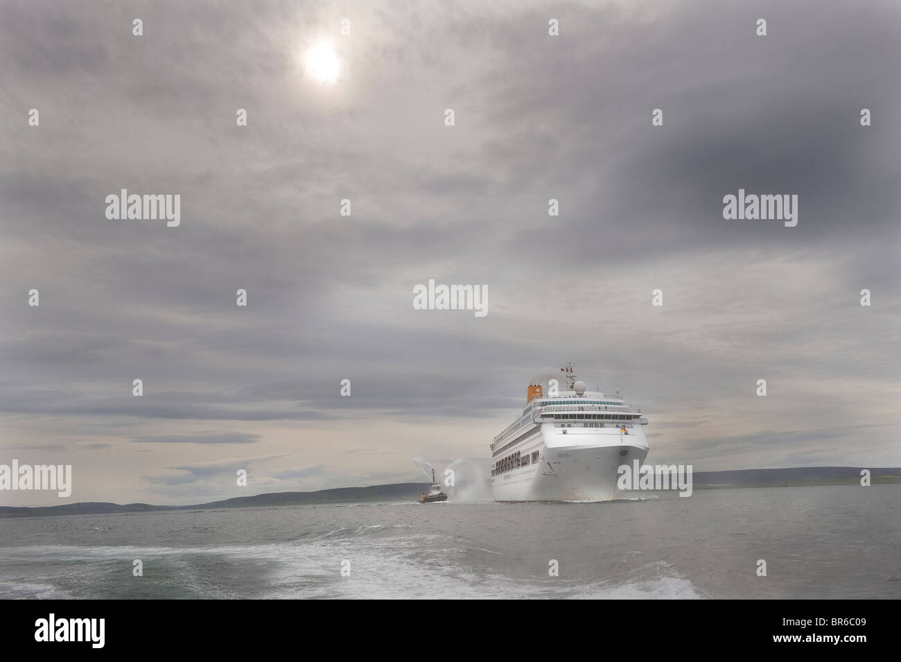 The Cruise ship Oriana leaving Kirkwall Harbour Stock Photo