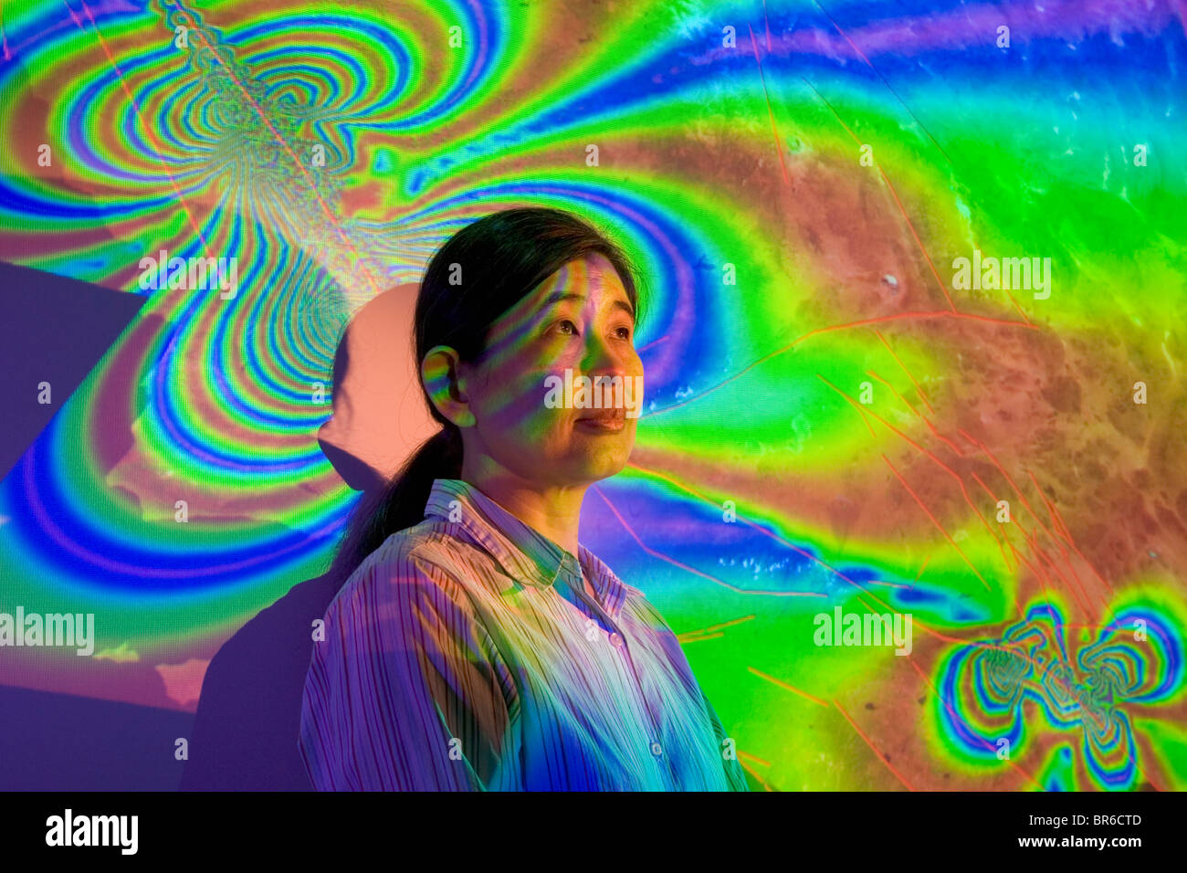 A woman and an earthquake graphic. Stock Photo