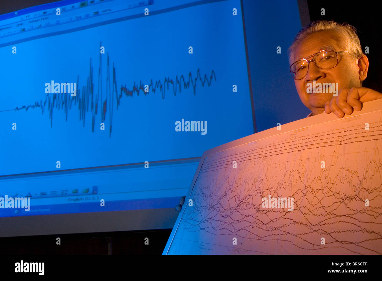 Earthquake scientist with graph. Stock Photo