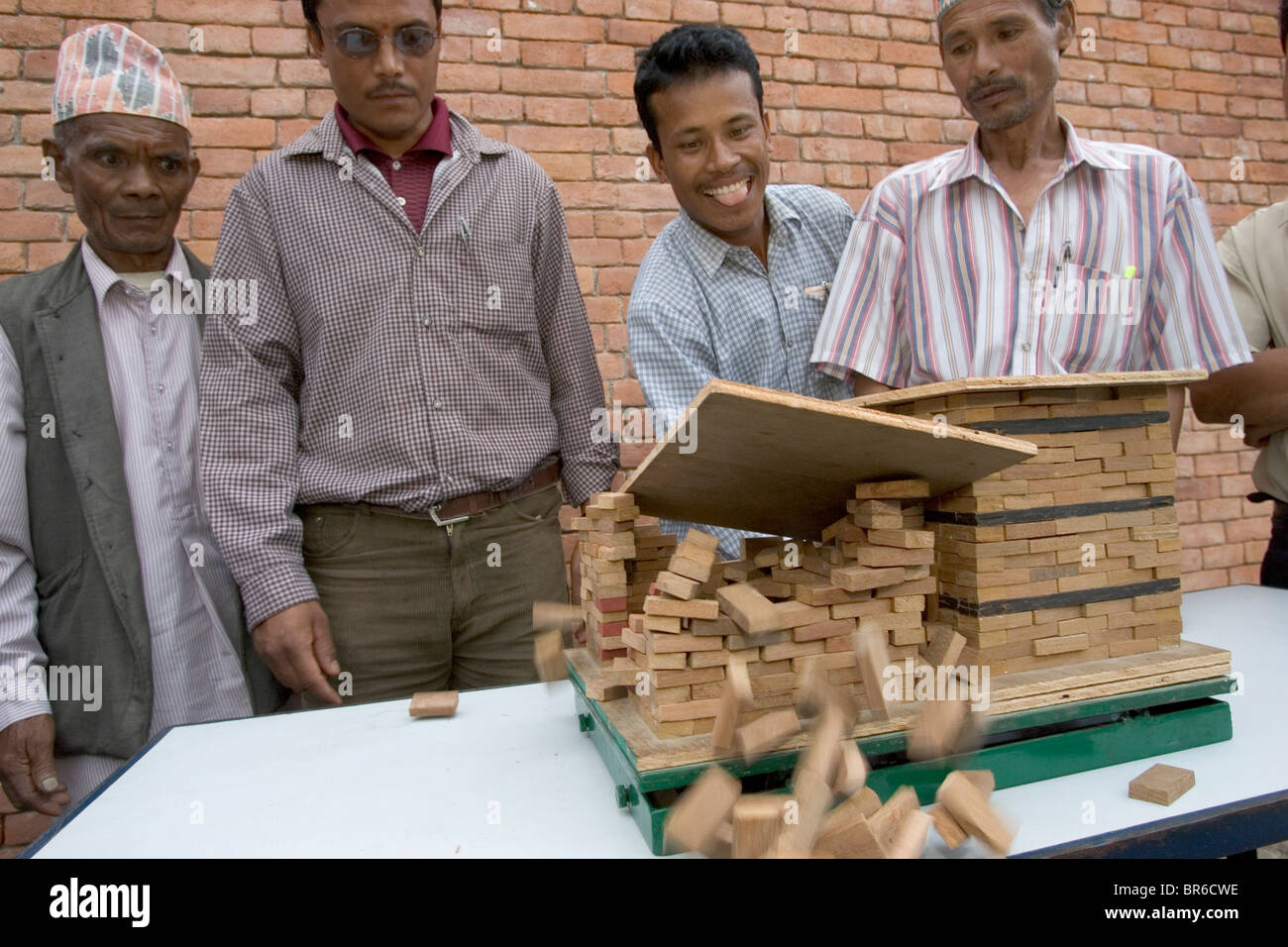 Shake table demonstration at Nepalese masonry workshop. Stock Photo