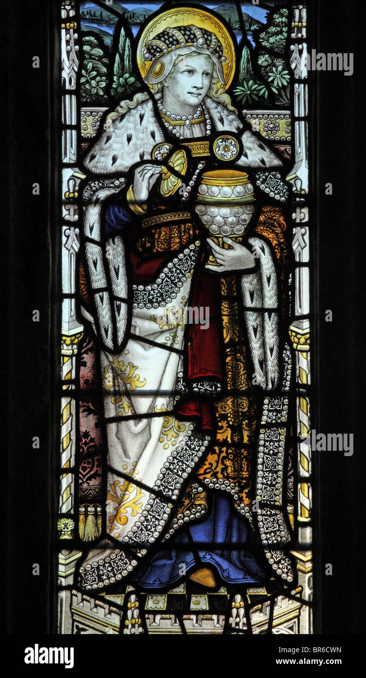 A stained glass window depicting St Mary Magdalene holding a jar of ointment 1907, Marhamchurch Church, Cornwall. Artist John Lisle Stock Photo