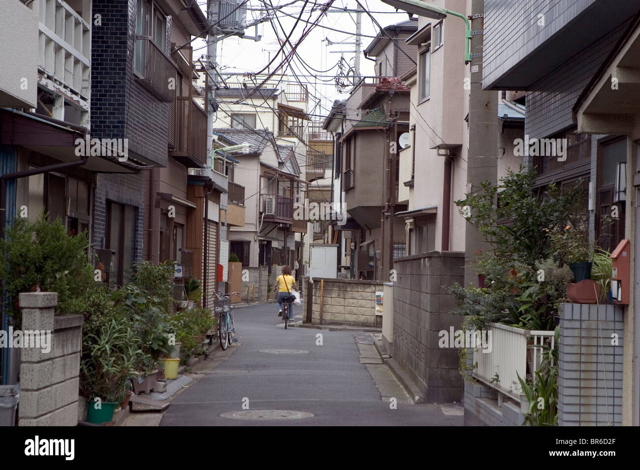 A densely-constructed alley in Tokyo becomes hazardous during an earthquake. Stock Photo