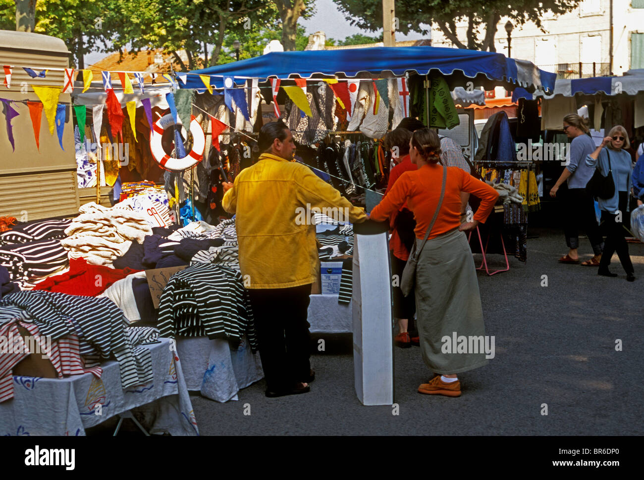 French people, clothing vendor, selling clothes, Wednesday Market, city