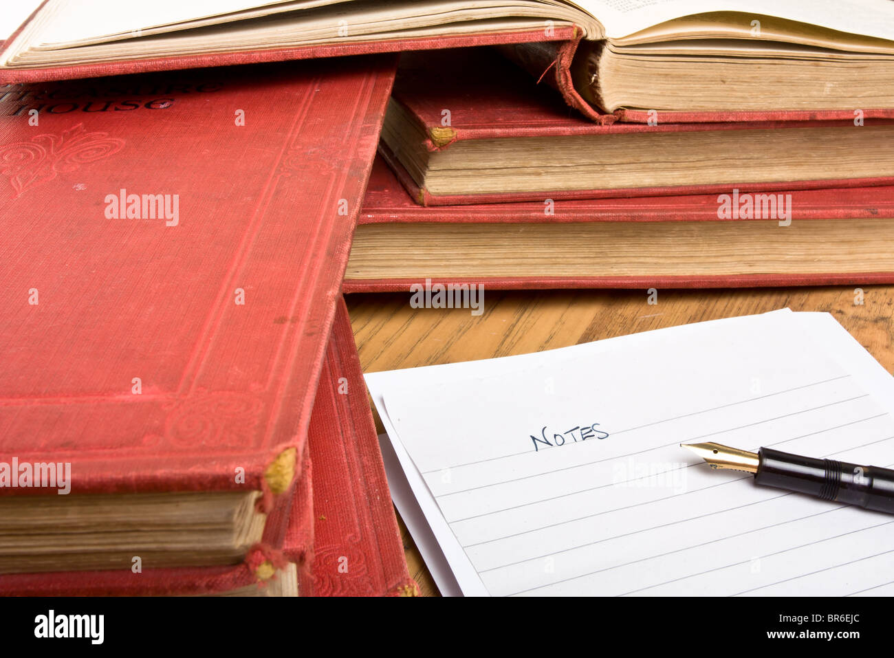 Pile of books, writing-book and pen Stock Photo - Alamy