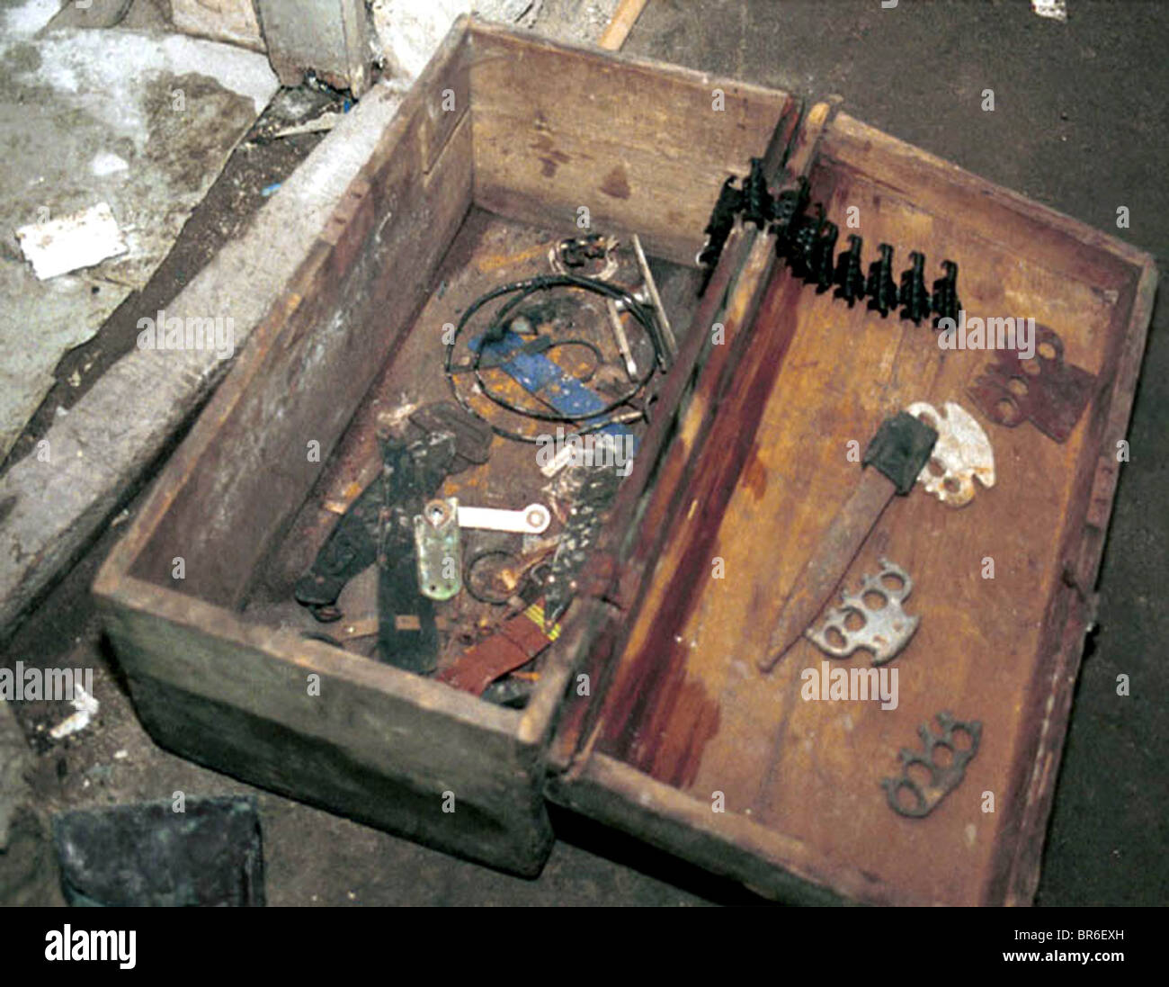 A box of weapons at police station torture chamber used by Serbian police in Pristina, Kosovo. Stock Photo