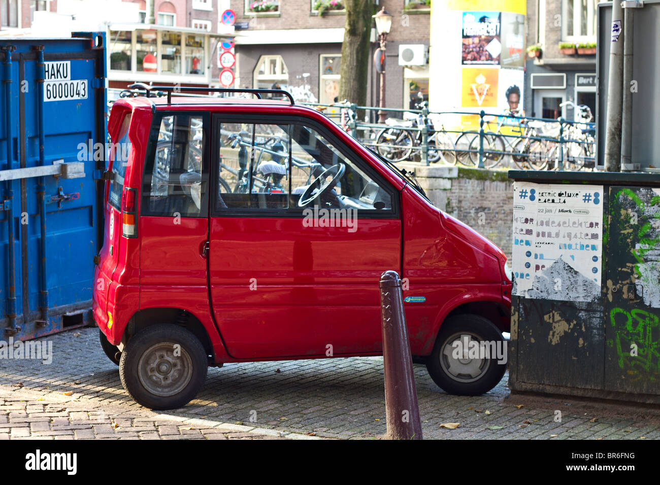 Red Canta LX car parked in small parking space. Amsterdam, Holland Stock Photo