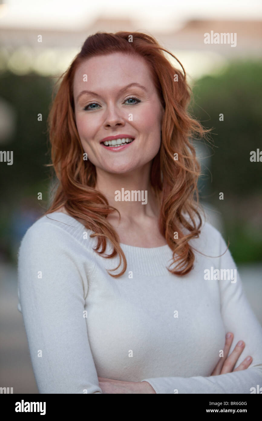 Attractive thirties caucasian woman in outdoor setting Stock Photo