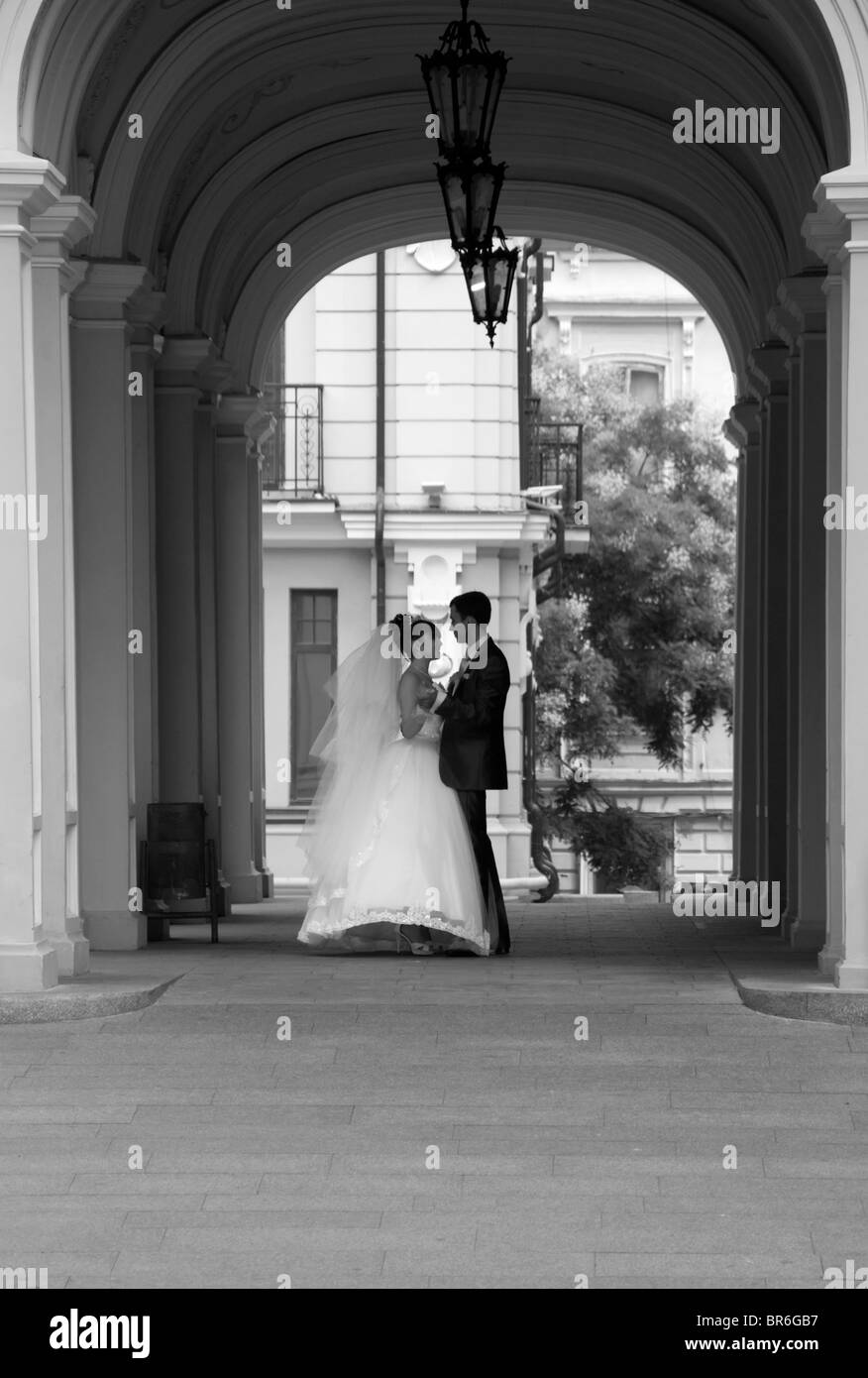 Just married couple enjoying a private moment outside the Opera House, Odessa, Ukraine. Stock Photo