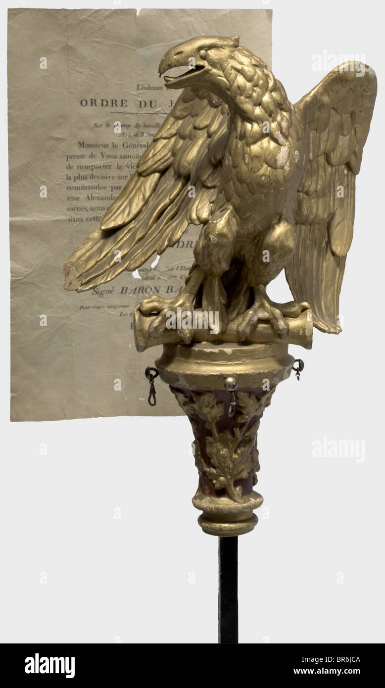 A wooden eagle for a regimental standard., Carved eagle with later gold paint. Height 40 cm. Also a replacement wooden pole with a threaded mount. Length 240 cm. A printed order of the day for 2 May 1813, concerning the Battle of Lützen, is appended. Presumably a patriotic eagle in the characteristic style of the 1st Empire. historic, historical, 19th century, France, Imperial, French Empire, object, objects, stills, clipping, cut out, cut-out, cut-outs, fine arts, art, art object, art objects, artful, precious, collectible, collector's item, collectibles, coll, Stock Photo