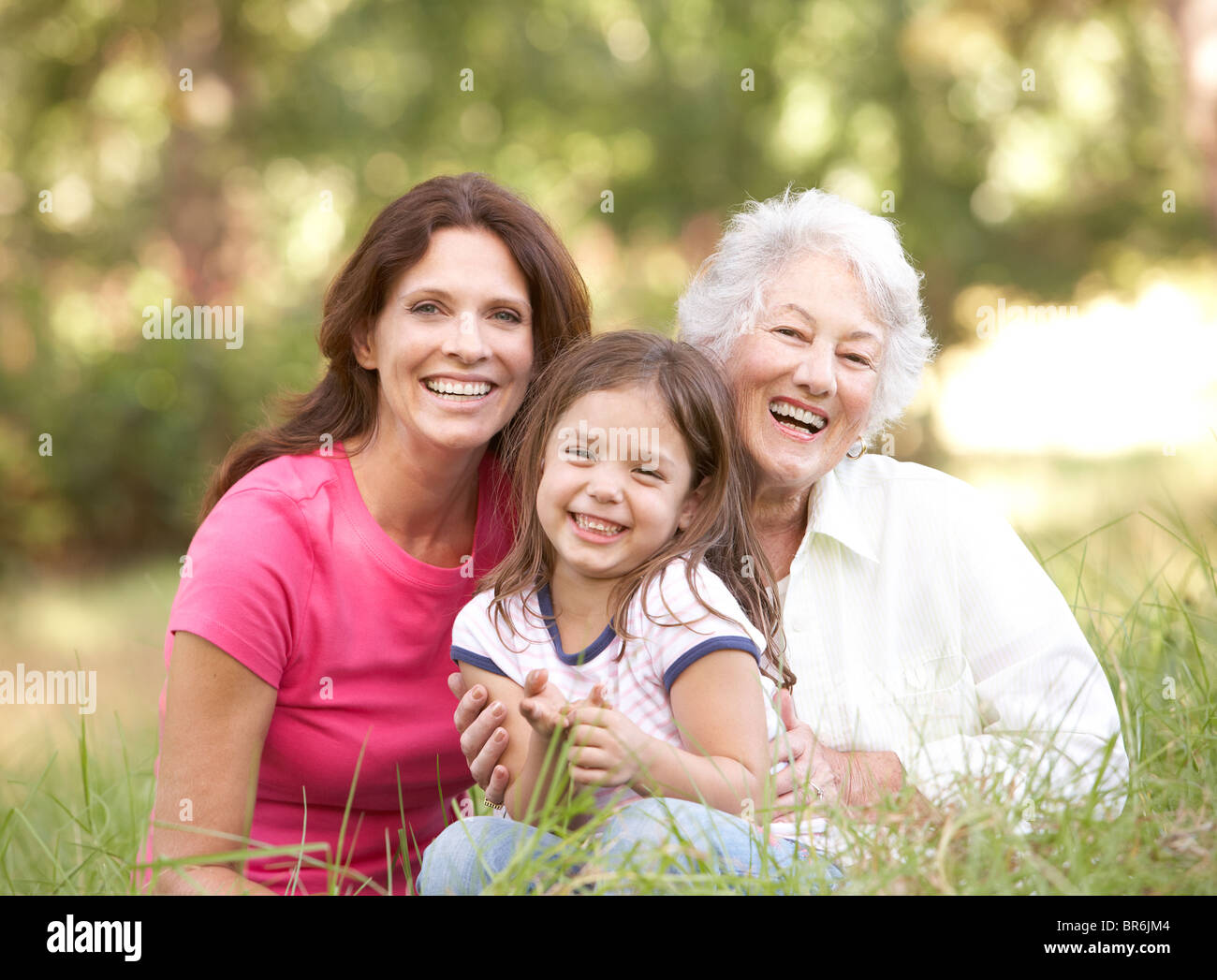 Grandmother With Daughter And Granddaughter In Park Stock Photo