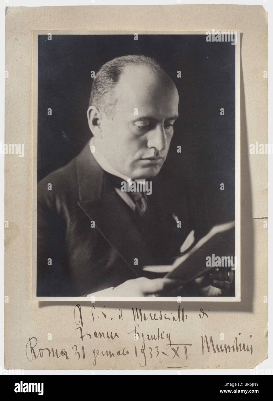 Field Marshal Hubert Lyautey (1854 - 1934) - a presentation photograph of Benito Mussolini with a personal dedication, A.s.e. il Maresciallo di Francia Lyautey Roma 31 gennaio 1933. XI Mussolini (To His Excellency Marshal of France Lyautey Rome 31 January 1933 XI Mussolini) in ink. Black & white photograph, dimensions 23 x 18 cm, on passpartout 32 x 23 cm. Lyautey, famous French Field Marshal, Resident-General for Morocco, and a well-known personality in colonial history. historic, historical, people, 1930s, 20th century, object, objects, stills, clipping, clip, Stock Photo
