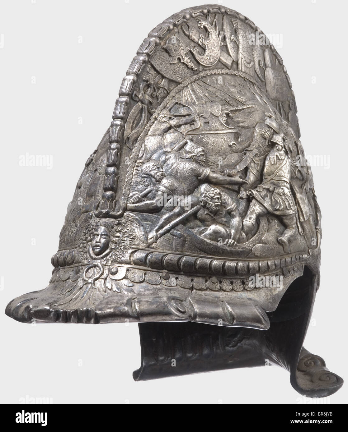 A silver-plated ceremonial helmet, in the style of the 16th century. Silver electroplated on copper. Made in one piece with a high comb and turned under, hollow-worked visor and neck guard. A depiction of the Judgement of Paris in half-relief on one side and one of the Abduction of Helen on the other. Each face of the comb displays trophies of war in relief. Very decorative helmet. Height 28.5 cm. historic, historical, 16th century, defensive arms, weapons, arms, weapon, arm, fighting device, object, objects, stills, clipping, clippings, cut out, cut-out, cut-o, Stock Photo