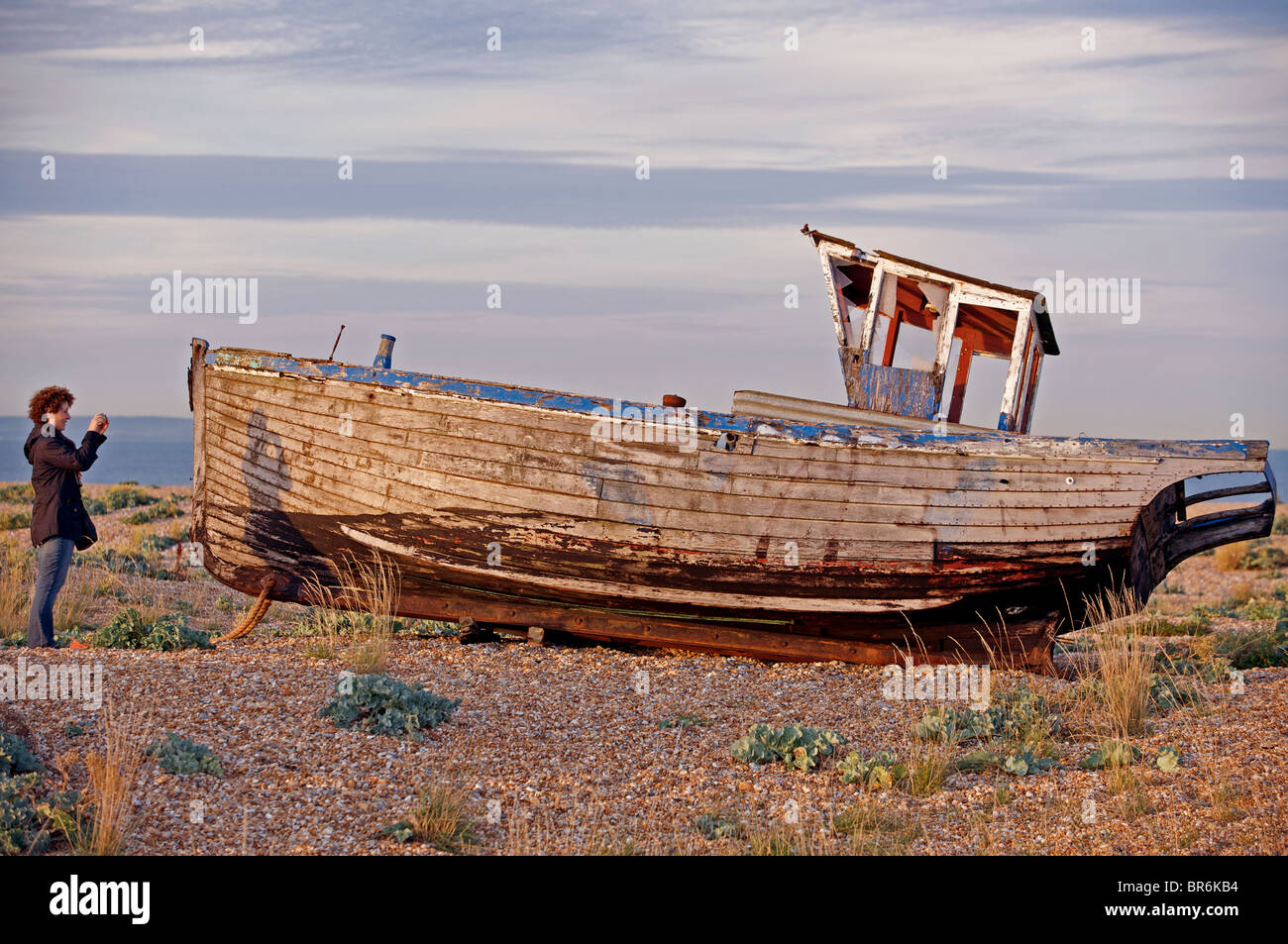 Disused wooden fishing boat, Dungeness, Kent, England. Stock Photo