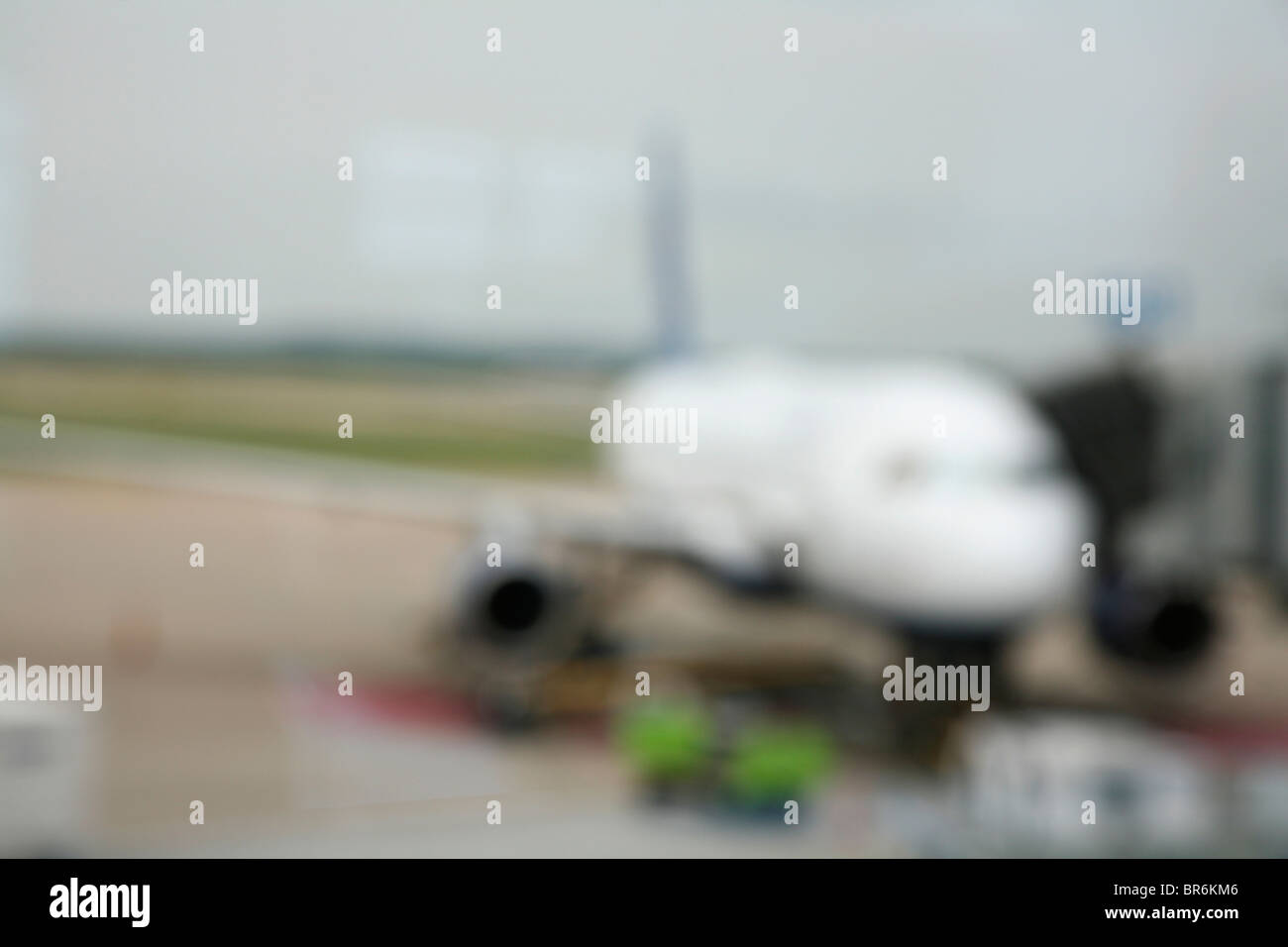 A plane on an airport tarmac, defocused Stock Photo