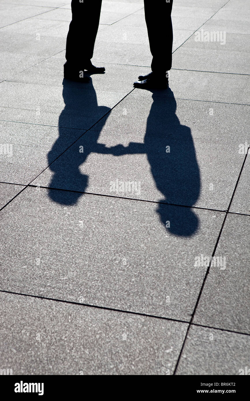Shadow men handshake hi-res stock photography and images - Alamy