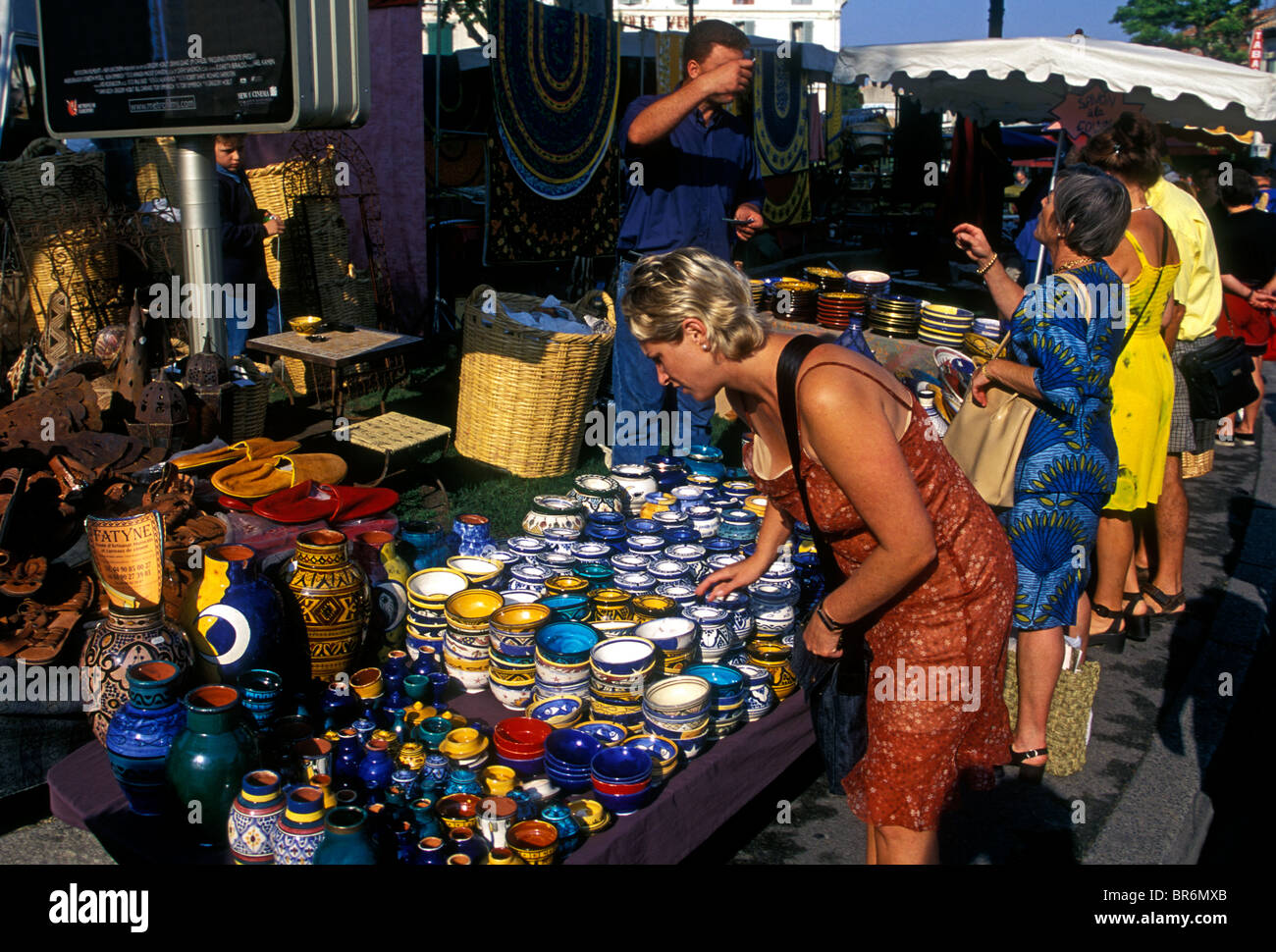 French woman, pottery vendor, selling pottery, ceramics, Wednesday