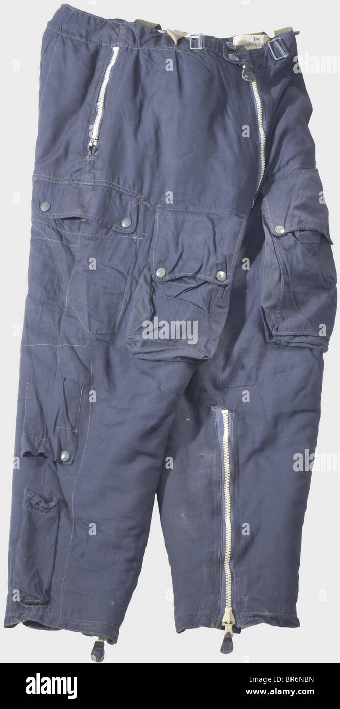 A winter flight suit., A bluish linen jacket with dark brown fur collar and lining, RiRi plastic zippers, Prym press buttons, a sewn-on RB No. label, and the size designation '2B'. Matching trousers of the same model, with a sewn-on RB No. label with size designation '1B'. Lining is loose in places, pocket zippers broken. Almost unworn, with unfaded colours. historic, historical, 1930s, 1930s, 20th century, Air Force, branch of service, branches of service, armed service, armed services, military, militaria, air forces, object, objects, stills, clipping, clippi, Stock Photo