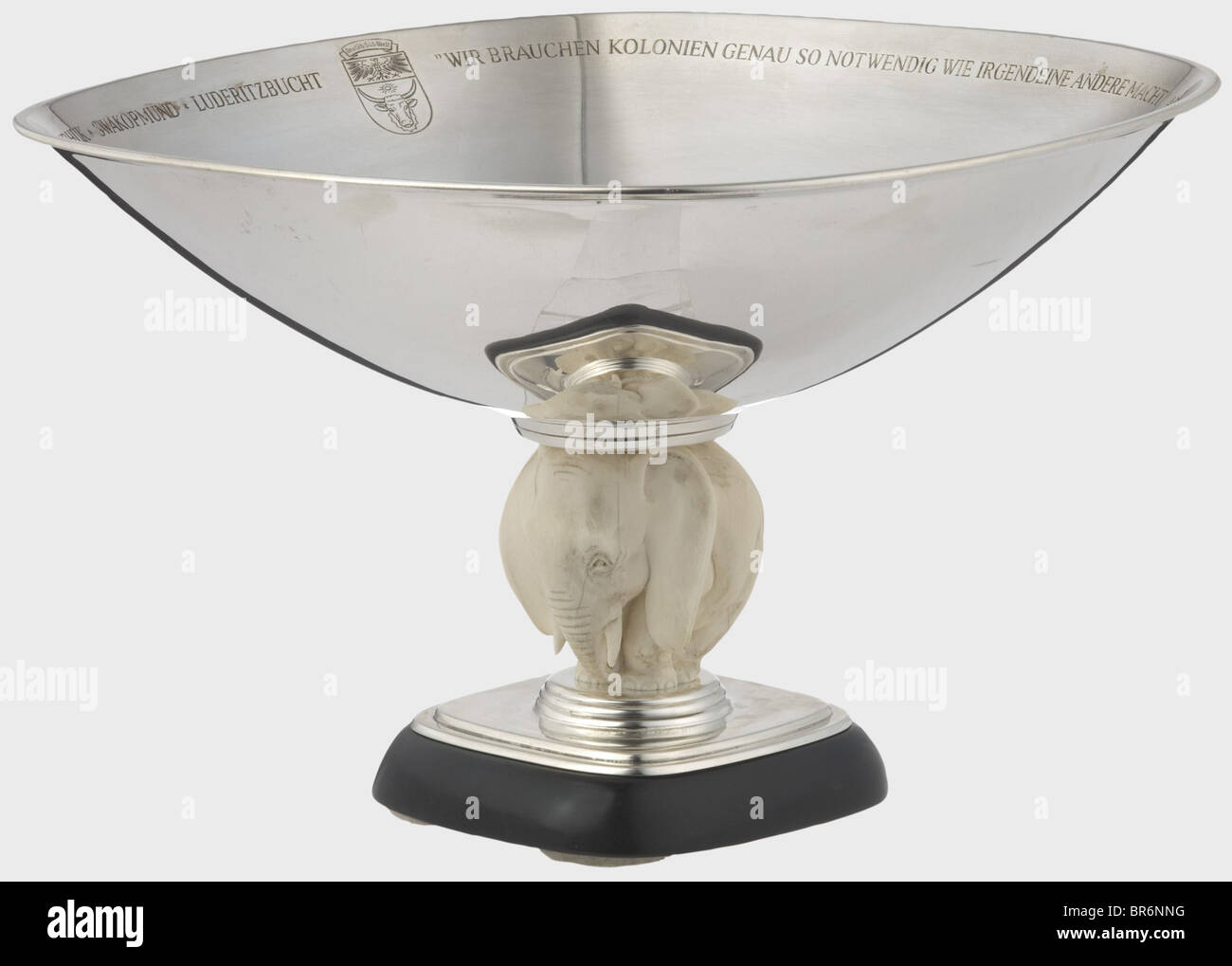Adolf Hitler - a silver bowl for his 50th birthday on 20th April 1939, a present from the German Boy Scouts of South West Africa., Elegant bowl resting on the back of a three-dimensionally carved African elephant mounted on an ebony socle with silver plinth, the latter with hallmark '925', crescent, crown and number '10022'. The interior of the bowl surrounded by the engraved quote and dedication 'We need colonies as much as any other power' - Adolf Hitler - from the German youth in South West, to its Führer Adolf Hitler for his 50th birthday * 20th April 1939 , Stock Photo