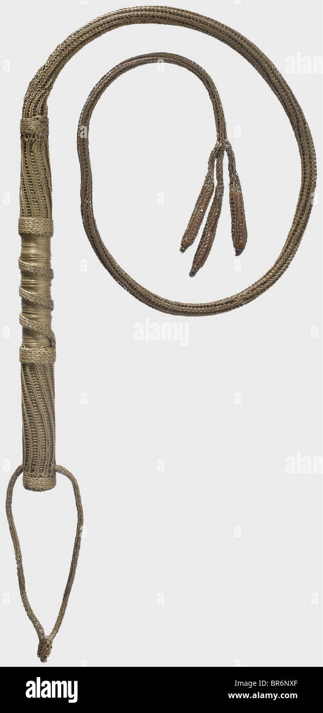 A German brass-braid dog whip, 17th century. The wooden grip entirely wrapped with corded brass wire and a braided lanyard. The whiplash also of braided brass wire with three-tailed end piece. Length 104 cm. similar whip in the 'Herzog Anton Ulrich Museum' in Braunschweig, attributed to Duke Julius of Braunschweig (1564 - 1613) historic, historical, 17th century, hunt, hunts, hunting, utensil, piece of equipment, utensils, trophies, object, objects, stills, clipping, clippings, cut out, cut-out, cut-outs, Stock Photo