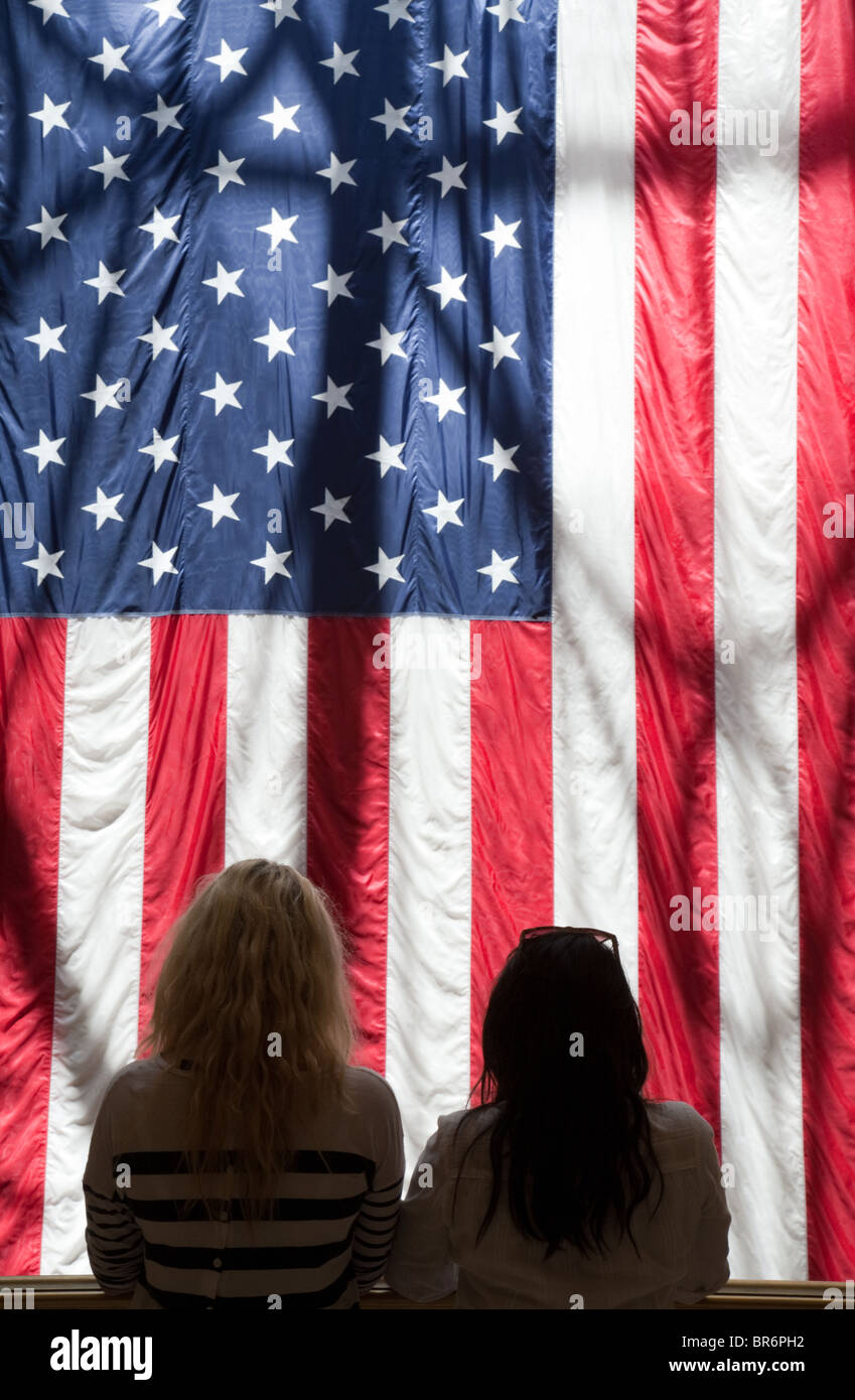 Two teenage girls standing with the American Flag, the Venetian Hotel, Las Vegas USA Stock Photo