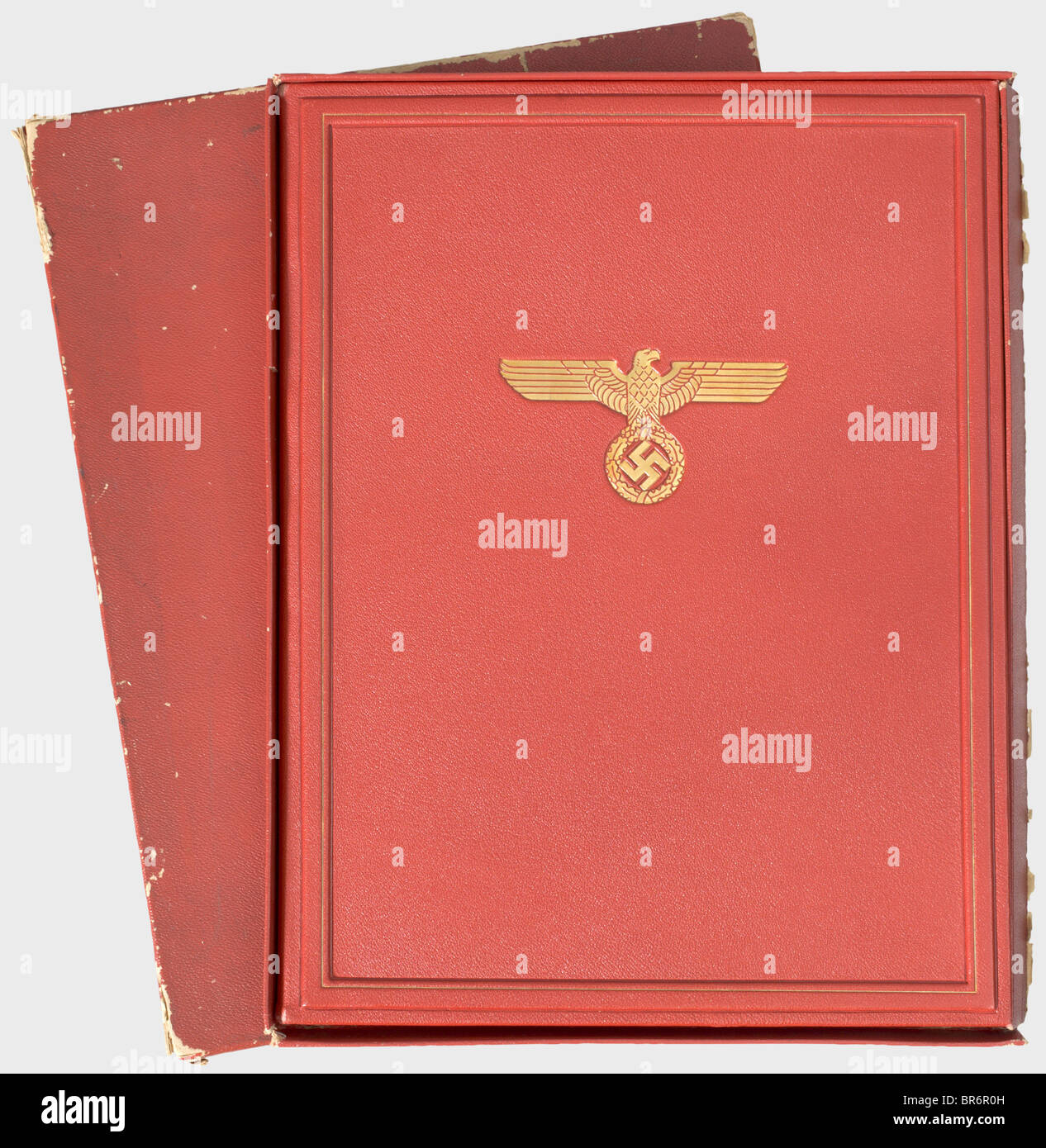 An award casement for the German Order., Red leather portfolio with a gold-stamped national eagle and border line, the interior with red silk liner (spotted), raised leather frame with gold border and lateral insert for the award document. Dimensions 32 x 42 cm. In a damaged red protective carton. Very rare. These folders, stored at the Brown House in Munich, were appropriated by a G.I. Laid in is an occupation forces programme dated 1 June 1945. historic, historical, 1930s, 20th century, document, documents, certificate, certificates, NS, National Socialism, N, Stock Photo