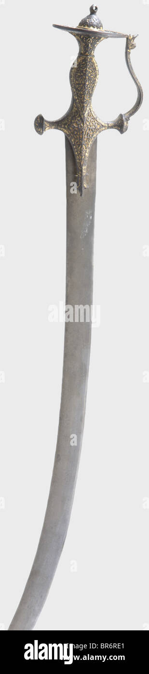 An Indian tulwar with chiselled hilt, 18th century. Strongly curved ...