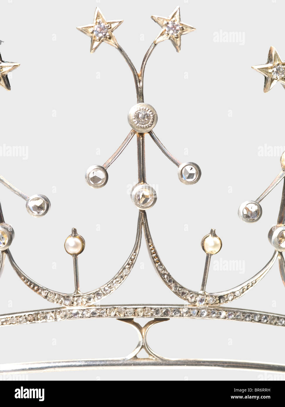 A star diadem, end of the 19th century. Rose gold, silver, old-cut diamonds, diamond chips and ten orient pearls. Filigree work, surmounted by ten diamonds set in star-shaped frames. Weight 30 g. In a case lined with velvet and silk, with gold-stamped jeweller's name 'Peter Rath Juwelier - kgl. Hoflieferant München' (Peter Rath Jeweller - Purveyor to the Royal Court, Munich). It is said that this diadem originates from the posessions of the Barons of Würtzburg. This family is extinct in the male line since the death of Colonel Ludwig Veit of Würtzburg. He died , Stock Photo