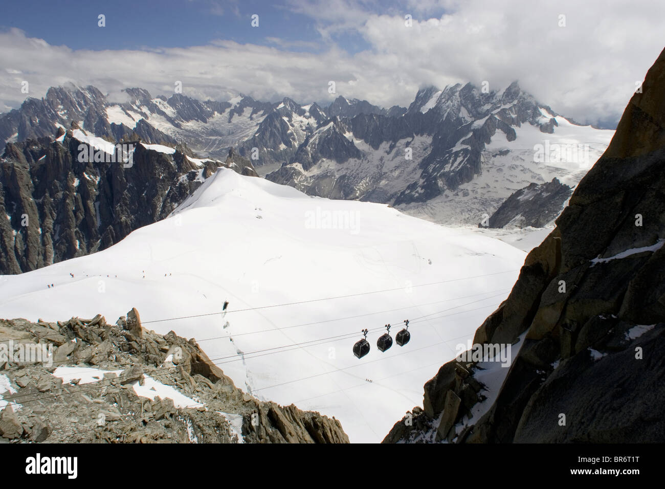 Cable cars leave from the Aiguille du Midi. French Alps. Stock Photo