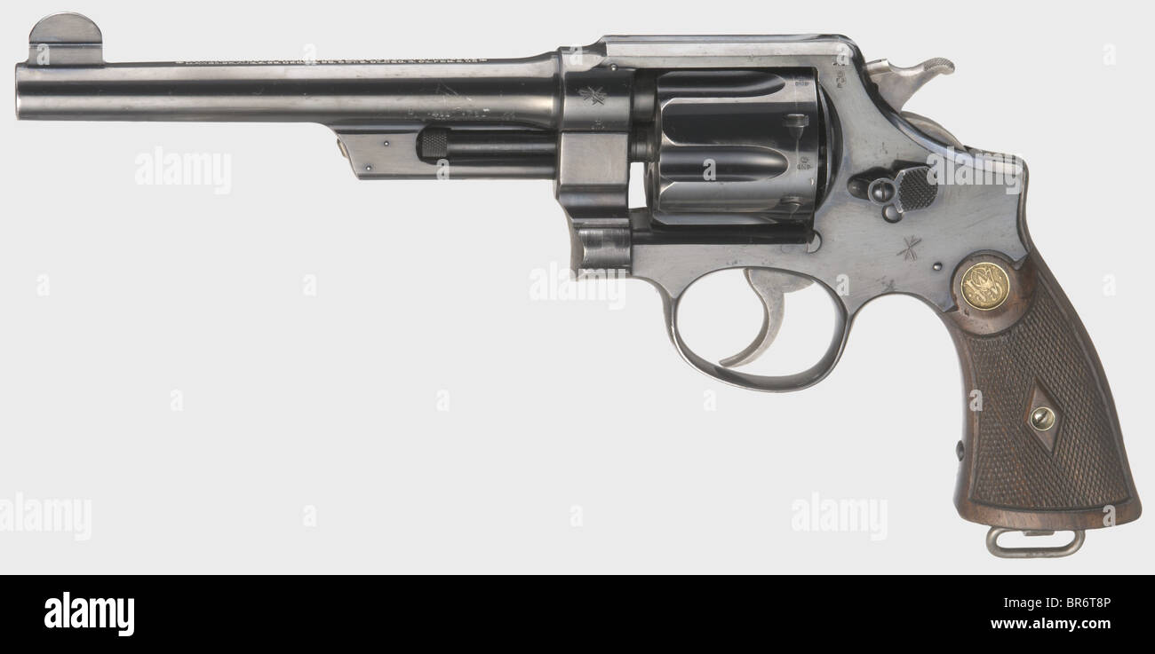 A Smith & Wesson .455 Mark II Hand Ejector 1st model (Triple Lock), cal..455, no. 1839. Bright bore, barrel length 6.5'. Manufactured in 1914. Various military acceptance marks broad arrow and crossed flags. Two-line standard inscription on barrel. Right grip panel marked 'J.F.O.TUTT.' at bottom. Original highly polished finish with light wear marks, spotted on grip, only few fine scratches on left side of barrel. Hammer and trigger colour case-hardened. Dark walnut grip panels with fine chequering and medallions. Lanyard ring. Top item hardly ever offered in t, Stock Photo