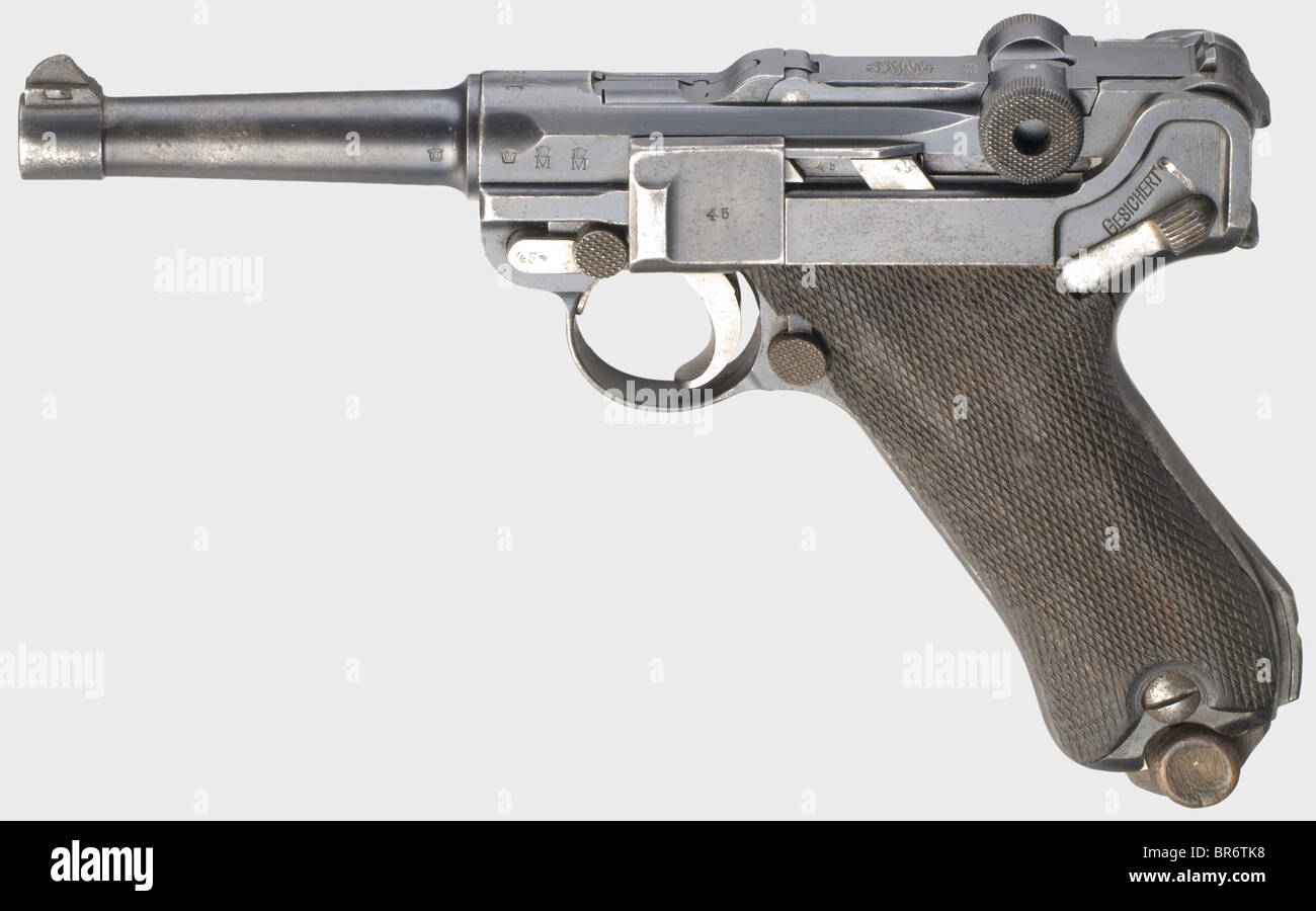 A pistol 08 DWM 1920, Reichswehr, navy, 9 mm Parabellum cal., no. 1145b. Matching numbers, firing pin without number, additional and unusual full serial number on right side of fork housing. Matt bore, barrel length 100 mm. Strong connective bolt with large collar as with pistol 04. Slot for shoulder stock. On the short, originally inscriptionless receiver head Reichswehr property mark '1920'. On left side of barrel and fork housing navy proof mark crown, on fork housing double navy acceptance marks crown/'M'. On front of grip vertically marked 'O.62.' (Ostseef, Stock Photo